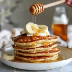 Greek Yogurt Pancakes for a Fluffy and Healthy Start 8 Greek yogurt pancakes with banana and yogurt topping